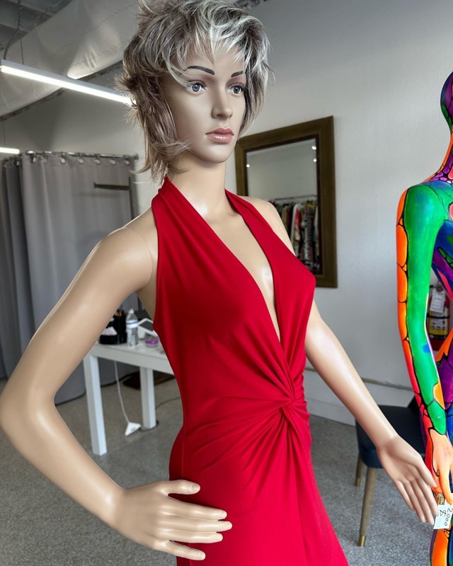 Red halter dress with a twisted waist