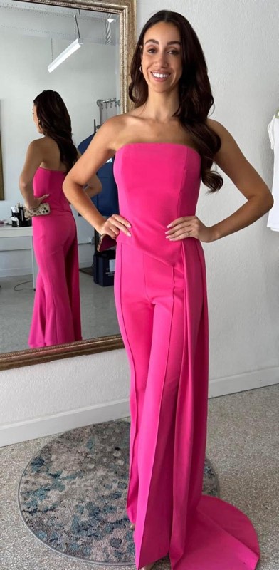 Pink strapless jumpsuit with a train